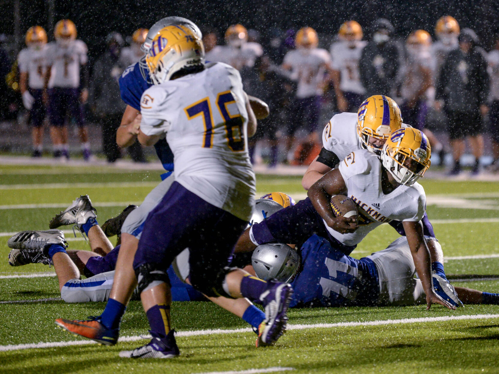 Hickman Running Back Keshawn Collins is tackled by Defensive Back Colton Sheehan